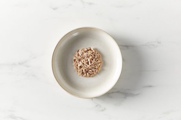 Reveal Tuna in Broth on a gray plate