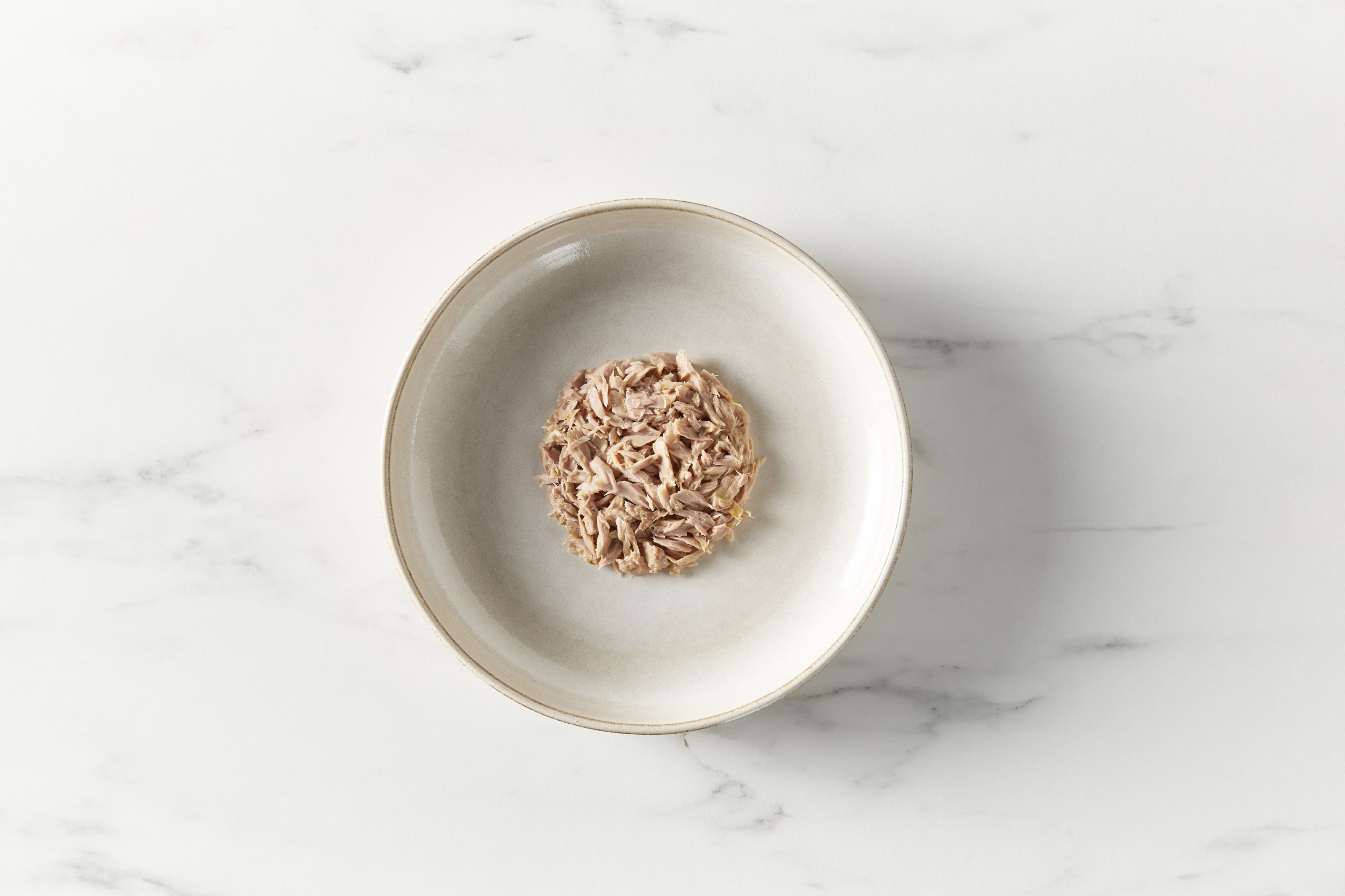 Reveal Tuna in Broth on a gray plate